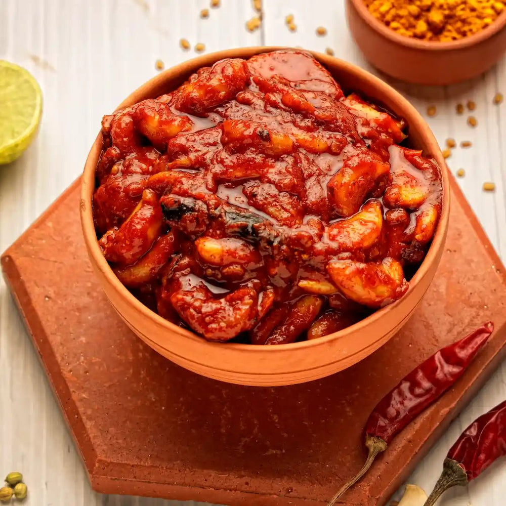 Close-up of spicy Lahsun Achar texture showing mustard oil and red chilli flakes.