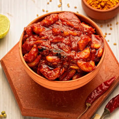 Close-up of spicy Lahsun Achar texture showing mustard oil and red chilli flakes.