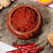 Swaadrani traditional homemade Ginger Pickle (Allam Pachadi) made with fresh ginger root, red chilli, tamarind, and jaggery in a bowl.