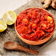 Swaadrani traditional homemade Lemon Pickle (Nimbu Achar) made with fresh chopped lemons, traditional Indian spices, and cold-pressed oil in a bowl.