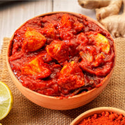 Swaadrani traditional homemade Lemon Pickle (Nimbu Achar) made with fresh chopped lemons, traditional Indian spices, and cold-pressed oil in a bowl.
