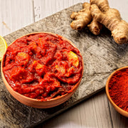 Swaadrani traditional homemade Lemon Pickle (Nimbu Achar) made with fresh chopped lemons, traditional Indian spices, and cold-pressed oil in a bowl.